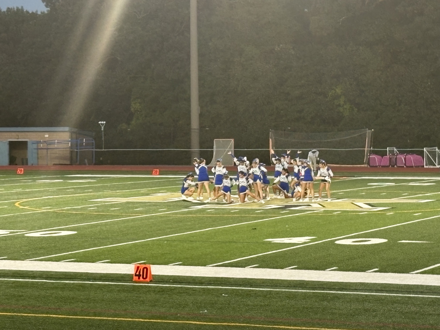 Cumberland cheerleaders performing at midfield during the game
