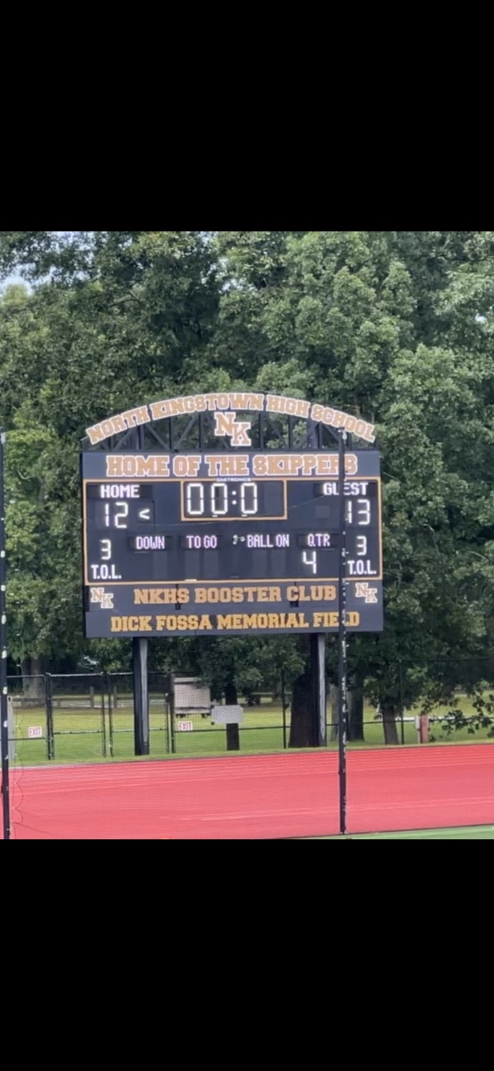 North Kingstown scoreboard showing home 12, guest 13, at the end of the fourth quarter